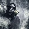 254b9c 15912466 a man in a gas mask in the smoke black background stock photo